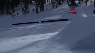 Pt. 2 skier jumps off big ramp and lands on front of skis, falls down slope