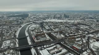 aerial view over the city near river winter 7