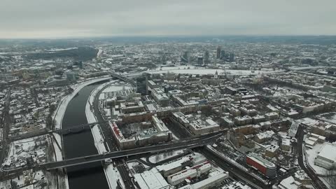 aerial view over the city near river winter 7