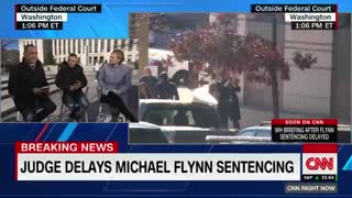 Flynn leaves court after a federal judge postponed his sentencing