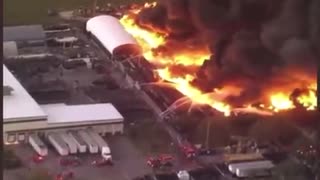 Firefighters are battling a massive 5 acres warehouse fire with potential hazardous fumes.