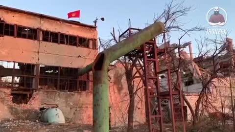 A red banner flies over Azovstal.