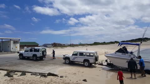 2 Land Rovers needed to pull boat out water