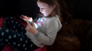 Playing on her phone