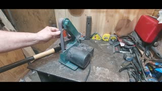 Harbor freight belt grinder sharpening a cold steel shovel