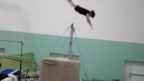 Gymnast Flipping On A Bar Gets Hit