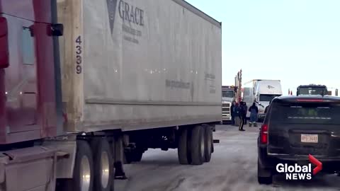 Trucker convoy: New blockade cuts off traffic to US as Coutts border protest continues