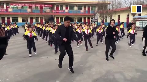 Chinese school principal teaches students shuffle dance during break