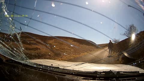 Driver Collides with Cyclist on Narrow Road