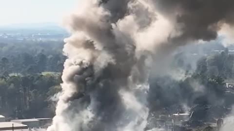 A massive metal scrap yard fire is being fought by firefighters in Charlotte North Carolina