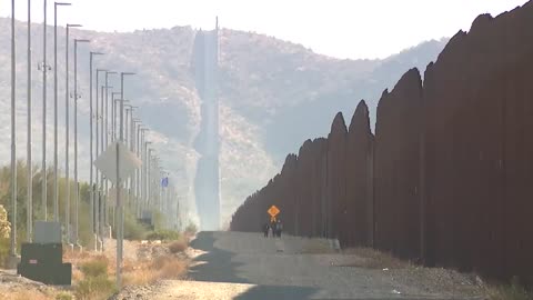 Lukeville, AZ: Groups of illegal immigrants rushed through a breach in the border wall
