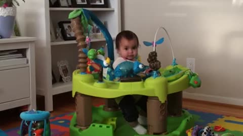 Playful child may have outgrown baby bouncer