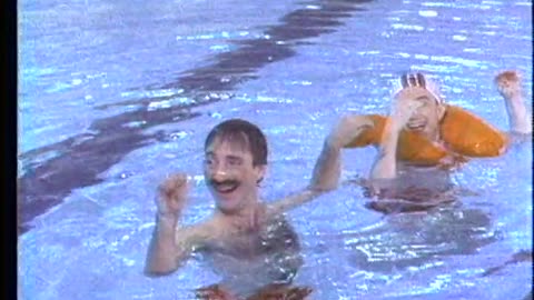 SNL sketch ‘Synchronized Swimming’ from 1984 with Harry Shearer, Martin Short, and Christopher Guest