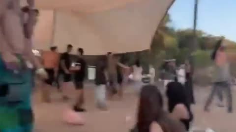 "Hamas Paraglider's Dramatic Descent at Music Festival in Israel - Captured On Video"