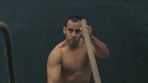Man doing rope exercise