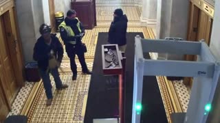 Footage of protester being uncuffed by Capitol police, and then fist bump another police officer