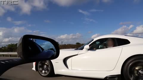 Two McLaren MP4-12C's battle a 2013 SRT Viper