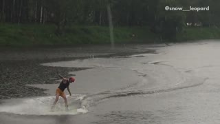 Collab copyright protection - guy wakeboards in rain fall