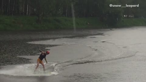Collab copyright protection - guy wakeboards in rain fall