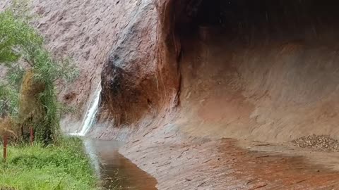 Stunning Desert Rains Roll Off Uluru