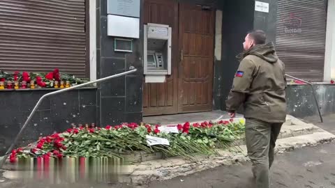 Head of the DPR Denis Pushilin lays flowers for death of civilians in Donetsk Ukraine strikes.