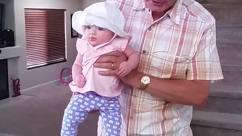 Grandpa Sings Song As He Helps Baby Dance