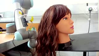 Robot brushes hair to help with patient care