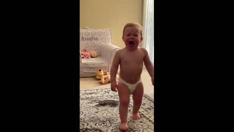 Dancing baby gets mad when mom stops the music