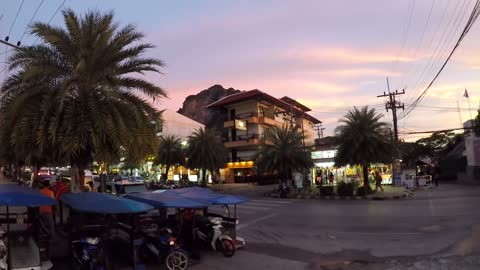 Tourists Passing by in toktok garage