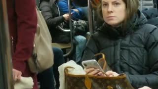 Woman preaching the bible on subway train