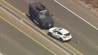 Man Sips Beer During Police Pursuit/Standoff