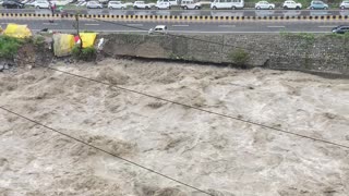 Car Swept Into River by Heavy Rainfall