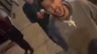 Guy blue shirt holding camera and friends screaming at it