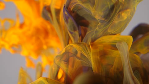 A spectacular 4k video with yellow ink in water