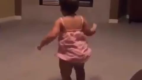 Adorable baby dancing and moving with the music