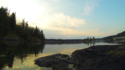 Beautiful Time Lapse Video Of Clouds Over a Peaceful Lake