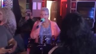 Grandma singing “Let the bodies hit the floor”