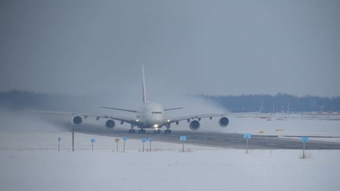 Spectacular Airbus A380 take off in snow