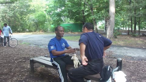 Luodong Massages Fit African Man On Park Bench