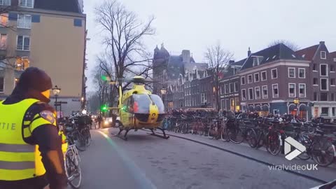 Helicopter takes off Amsterdam frozen canal