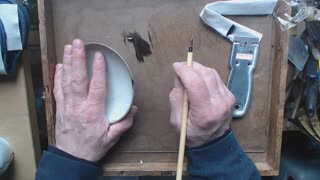 Traditional, lacquer based kintsugi, applying middle black