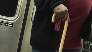 Guy red shirt cane dancing singing subway