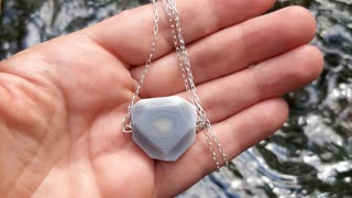 Botswana-Agate Sterling silver Pendant with water running in the background