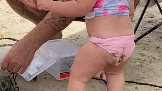 Toddler Tries To Taste Caught Fish