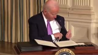 The Video of Joe Biden and His Pen That Has Everyone Asking Questions