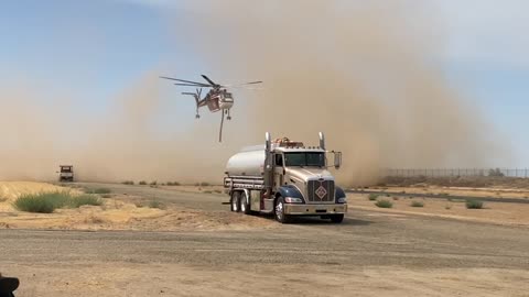 CH-54B lands and disappears in dust cloud!