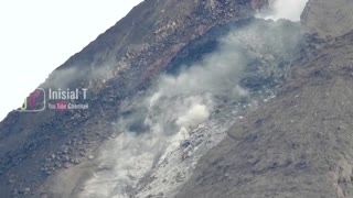 Clouds of ash roll down Indonesia volcano