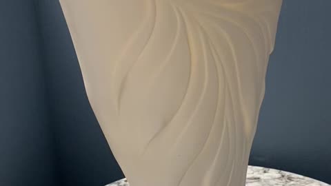 Translucent porcelain sculpted vessel.
