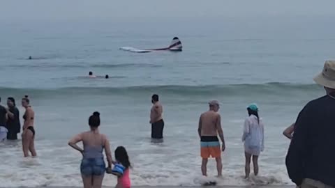 Small plane crashes Into surf at New Hampshire's Hampton Beach