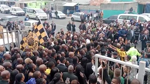 Final whistle for Fleurs: Thousands gather for football star’s funeral